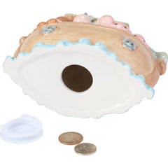 Noah's Ark piggy bank displayed on a nursery shelf for decor and storage.