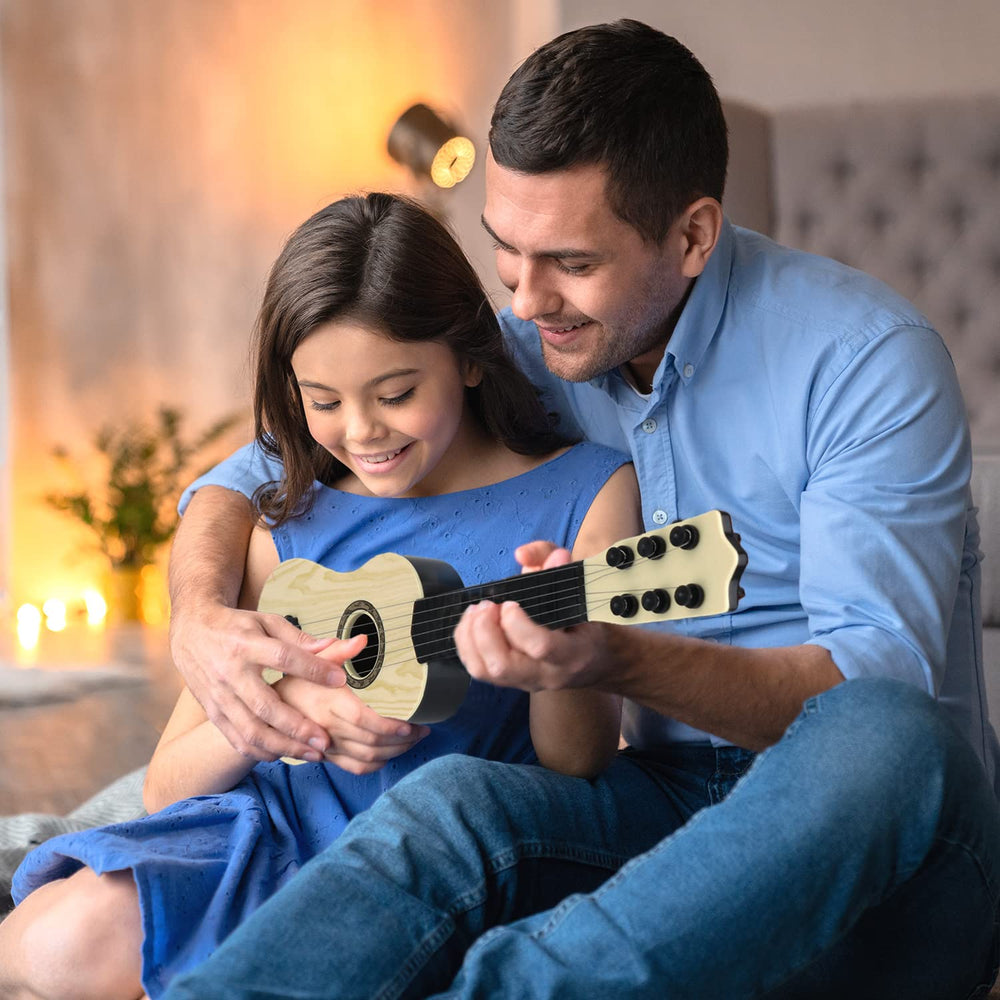 QDH 17-inch toy guitar side view highlighting lightweight design