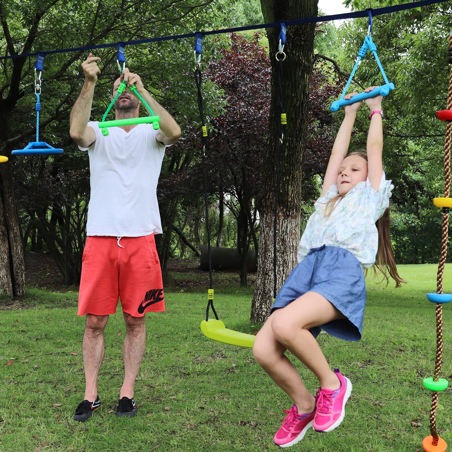 Rainbow Craft ninja obstacle kit set up in a backyard playground.