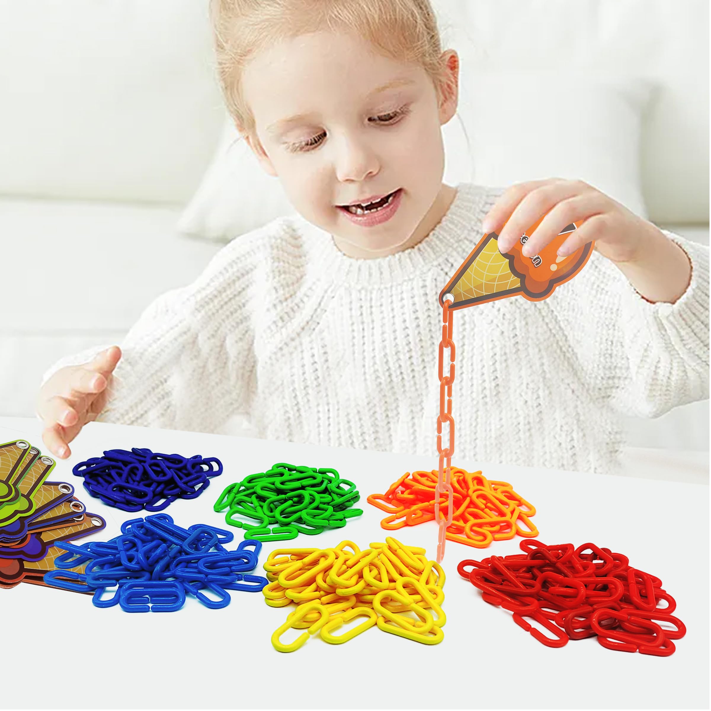 Rainbow Toyfrog chain links build fine motor skills during play.