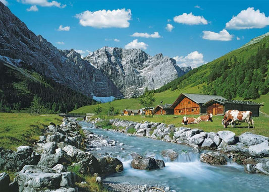 Ravensburger Austrian Mountains puzzle: snow-capped peaks scene ideal for family game night.