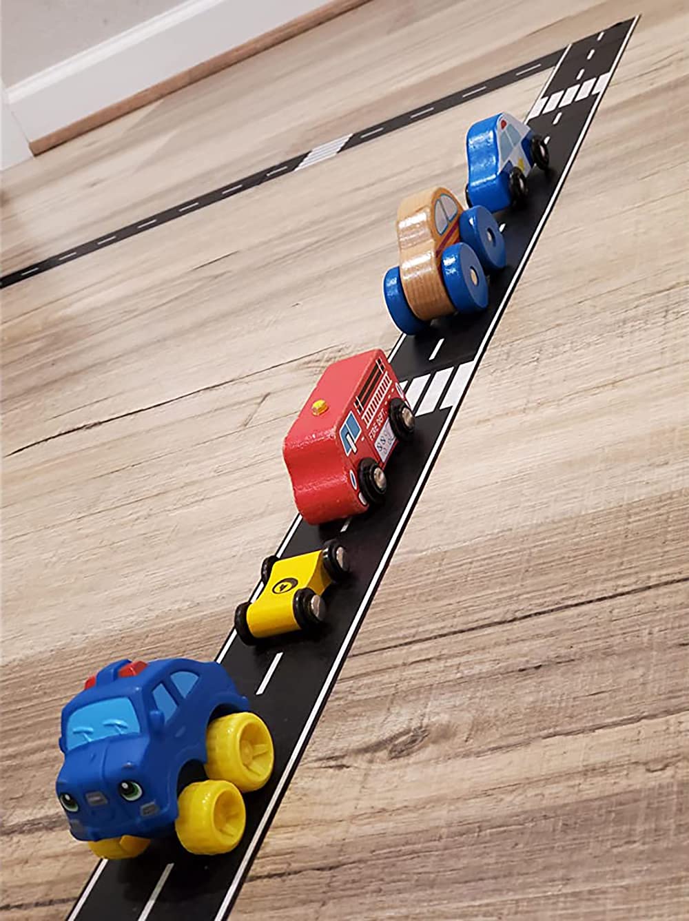 Kids playing with RECER Track Tape, demonstrating safe, repositionable decorating fun.