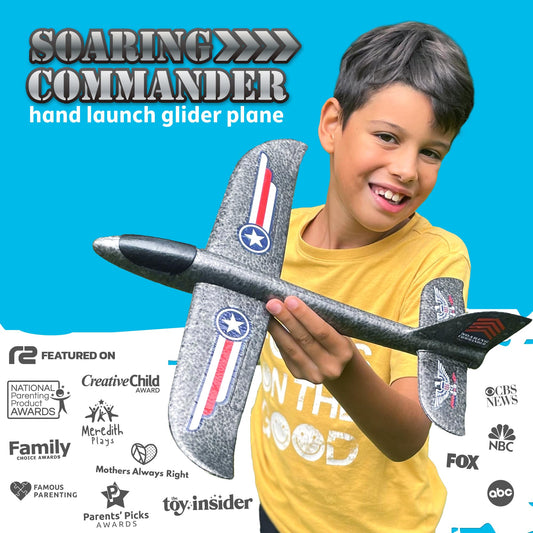 Kids in park throwing Soaring Commander planes for active play