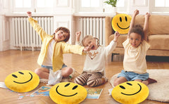 RENAMB Smiley Face Pillow doubles as a cozy travel companion for trips.