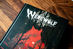 Renegade Games Studios Werewolf core rulebook open pages, quick access to character options.