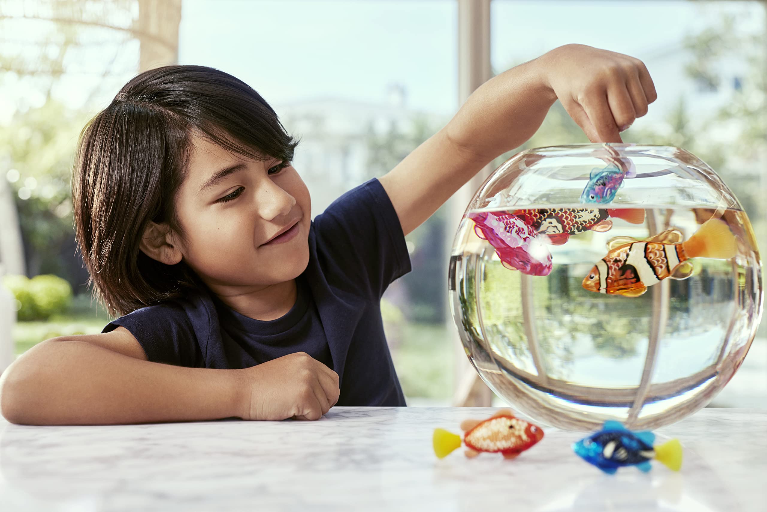 Robo Alive teal and orange Robo Fish in prank-friendly water scenarios for fun reveals.