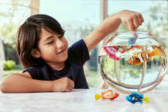 Robo Alive teal and orange Robo Fish in prank-friendly water scenarios for fun reveals.