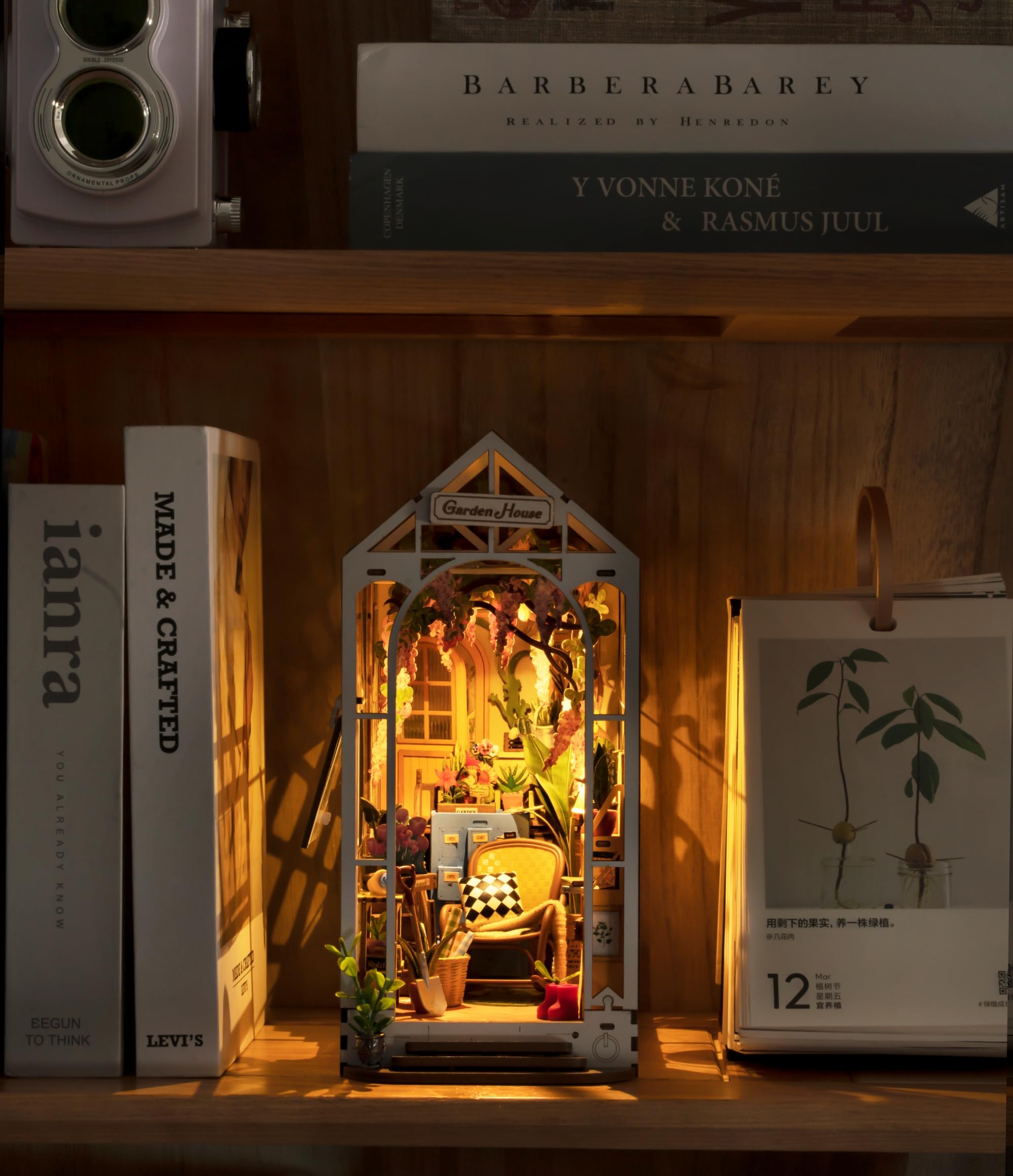 Robotime Books and plants on shelves form a lush mini scene.