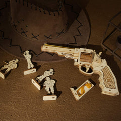 ROBOTIME gun model kit close-up reveals precision laser-cut parts and rubber bands for reliable play.