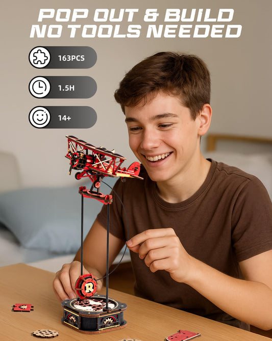 ROBOTIME plane model kit on display with rotating propellers for enthusiasts.