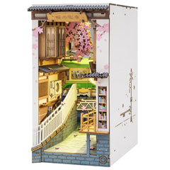 ROBOTIME Sakura Tram booknook kit assembly showing interlocking wood pieces for a decorative shelf display.