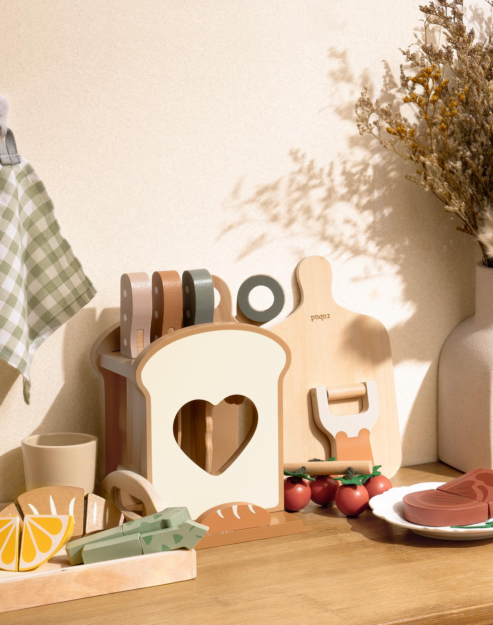 ROBUD wooden peeler and cutting board for safe pretend prep.