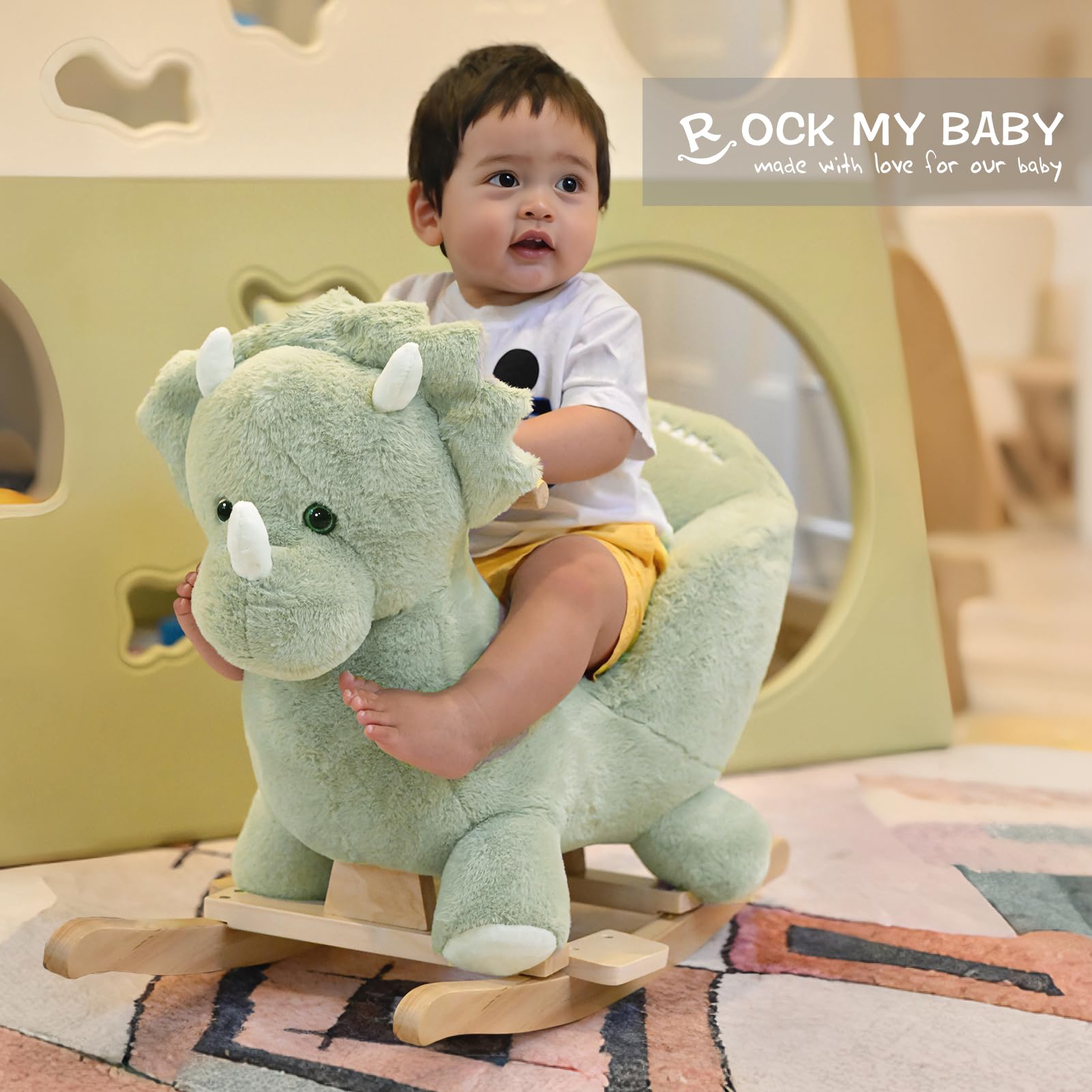 Lullaby ears on Rock My Baby green dinosaur rocker emit soothing tunes for toddlers.