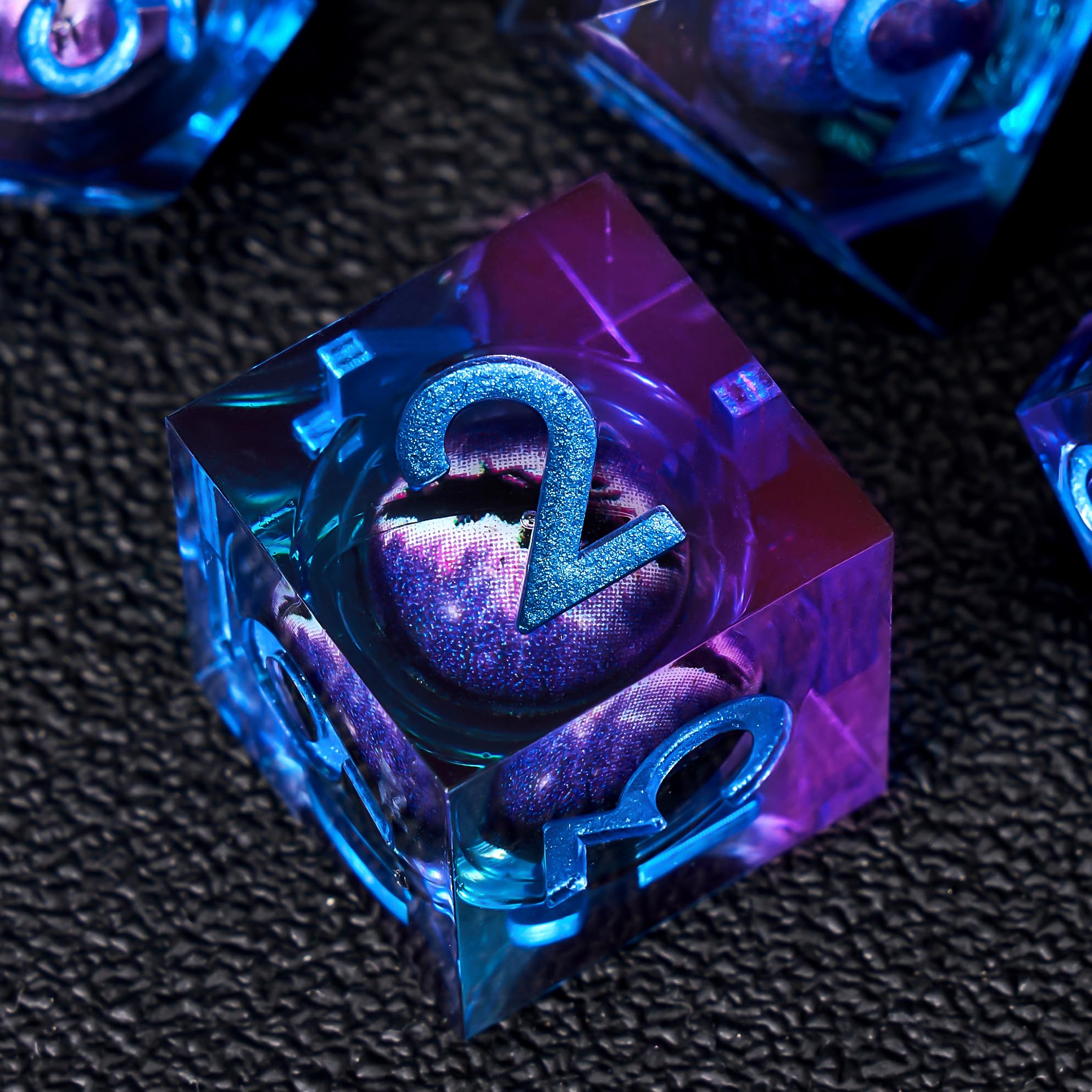 Beholder Dragon Eye dice with liquid core resin shimmer in blue purple.