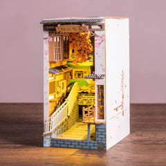Rolife Sakura Densya river scene with glowing lights enhances display decor