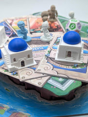 Roxley Games Santorini Second Edition art elevates theme and enhances immersion during play.