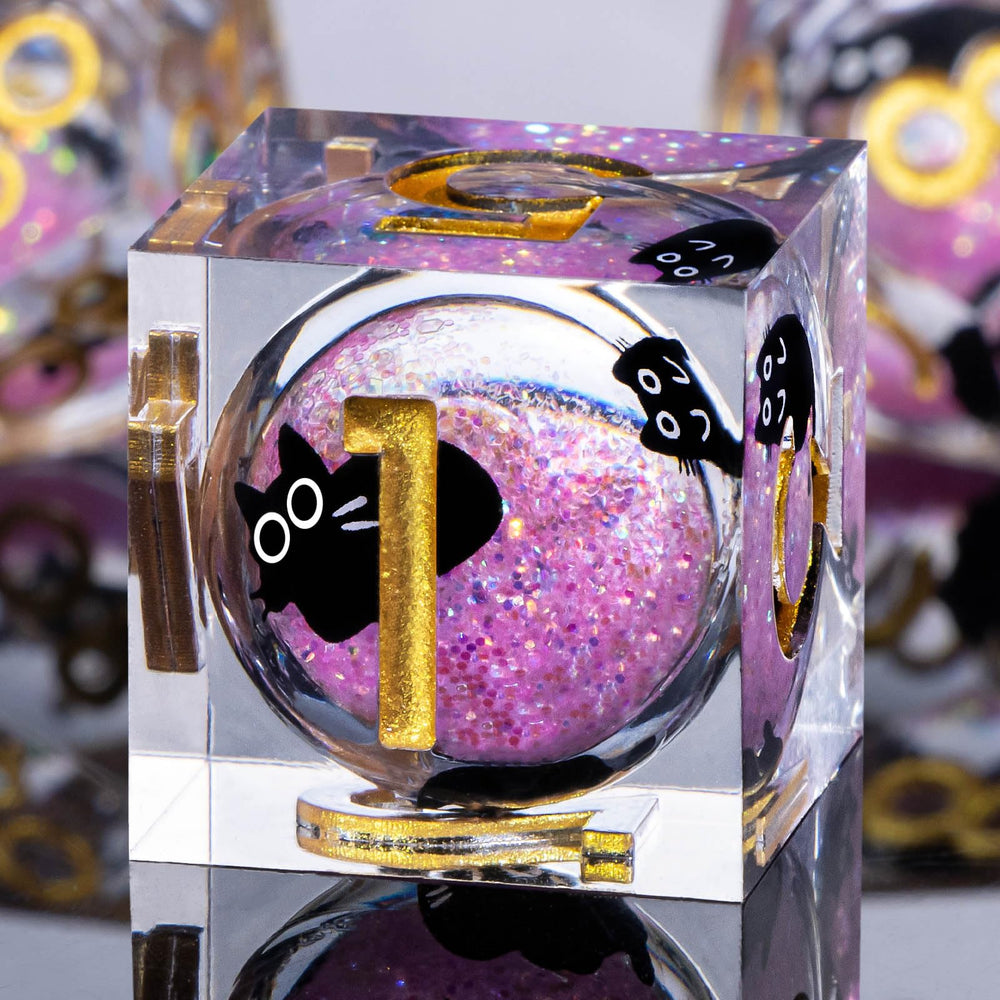 Roycevon gift-boxed cat-themed dice set in pink, ready for tabletop adventures.