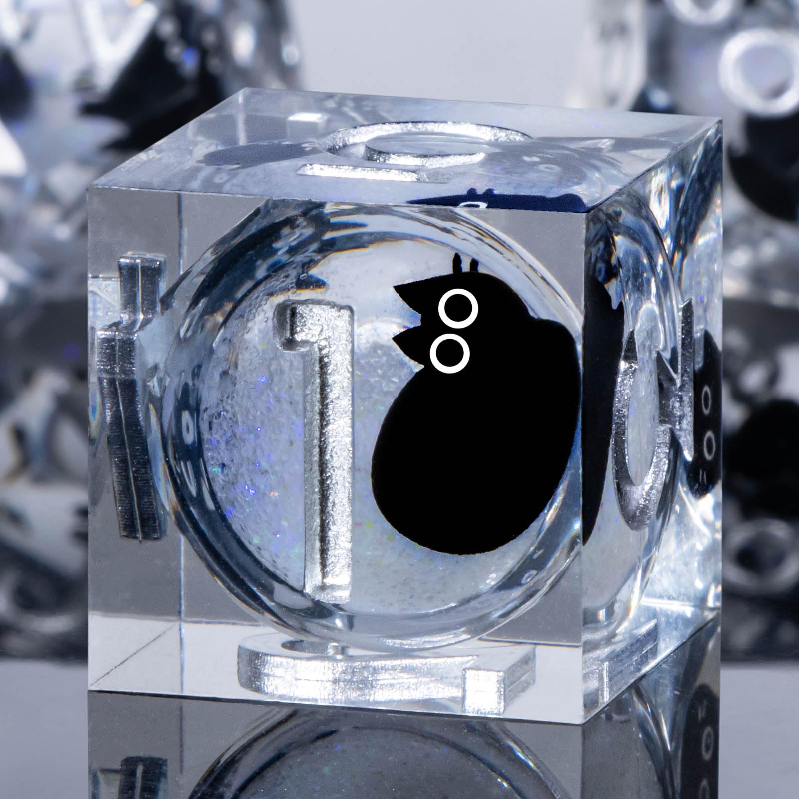 Roycevon liquid-core cat dice with clear surface for dramatic rolls.