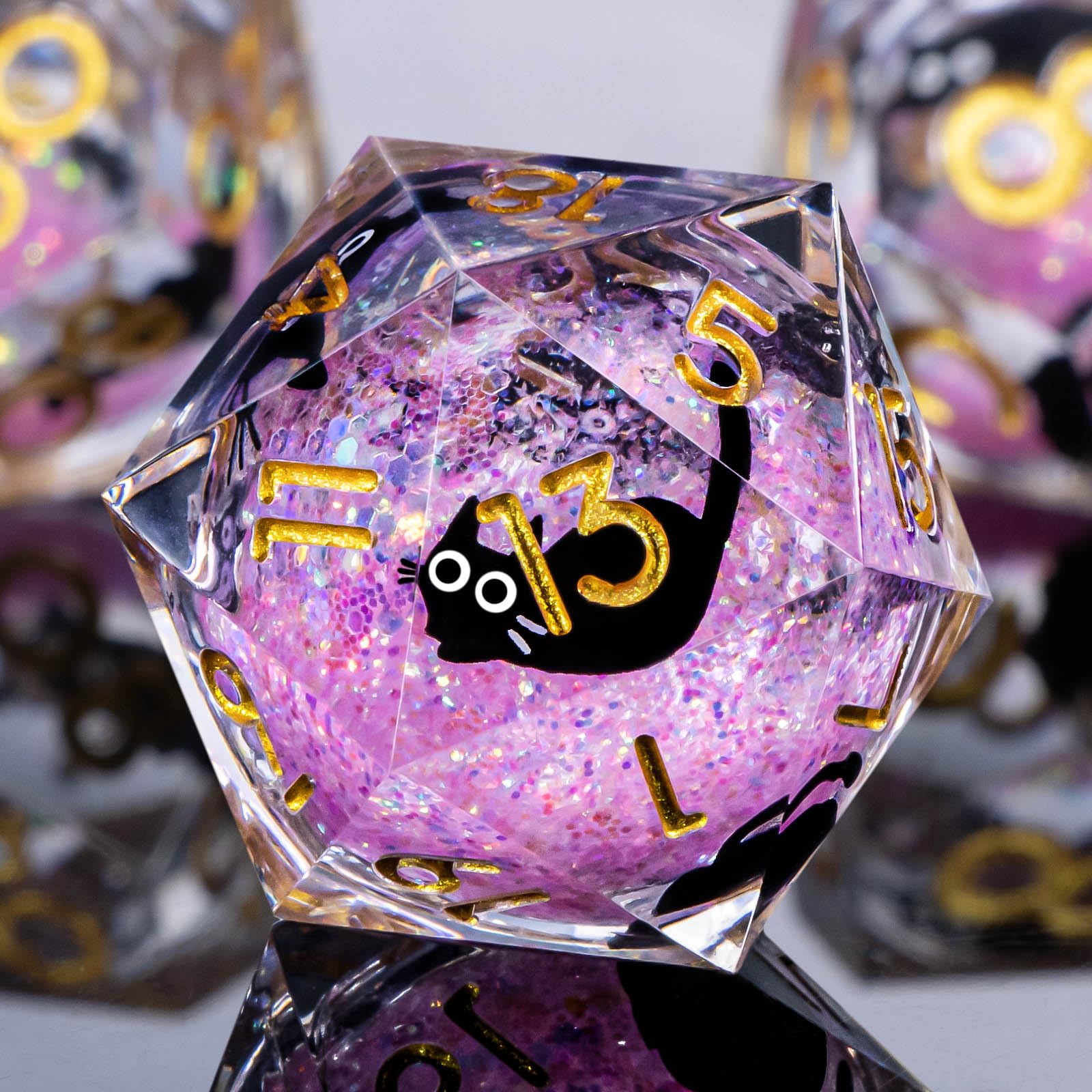 Roycevon resin DND cat dice with pink liquid core for balanced rolls.