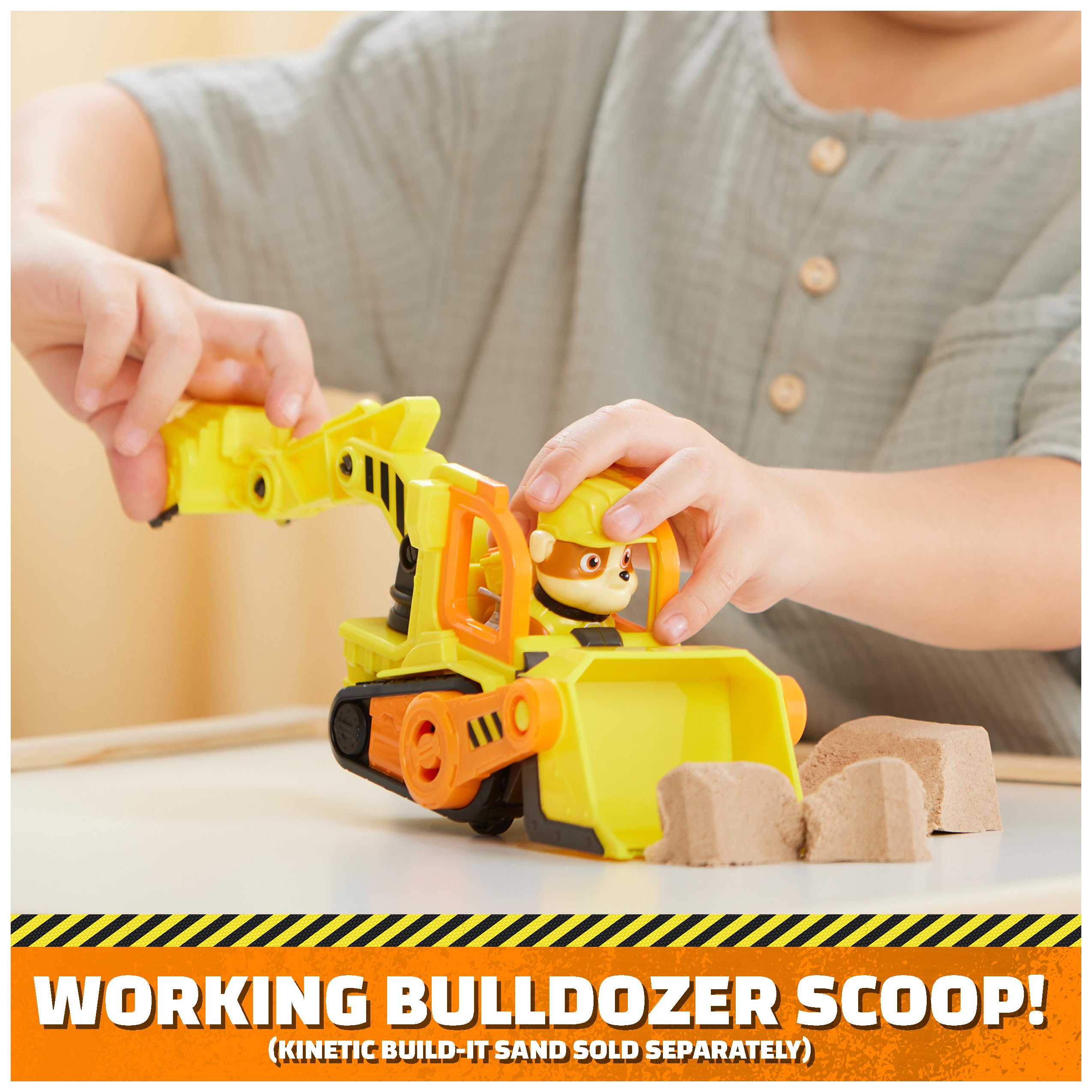 Rubble action figure seated in driver seat invites cooperative storytelling.