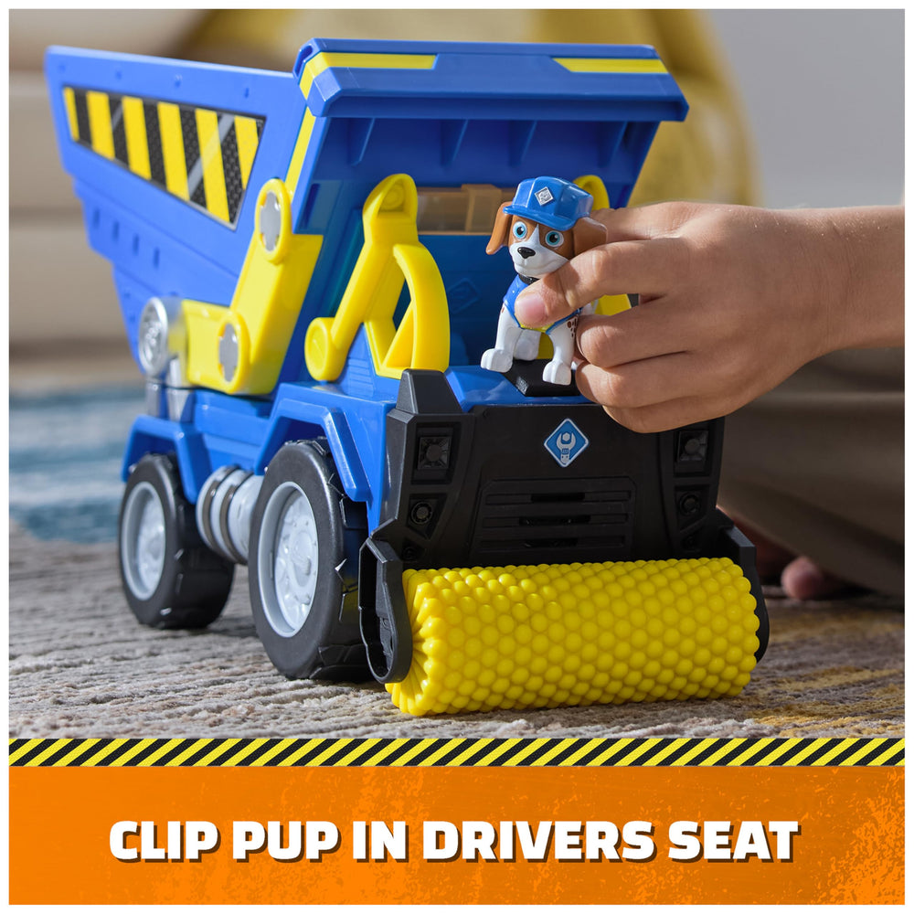 Compactor roller feature to flatten pretend dirt during construction play.