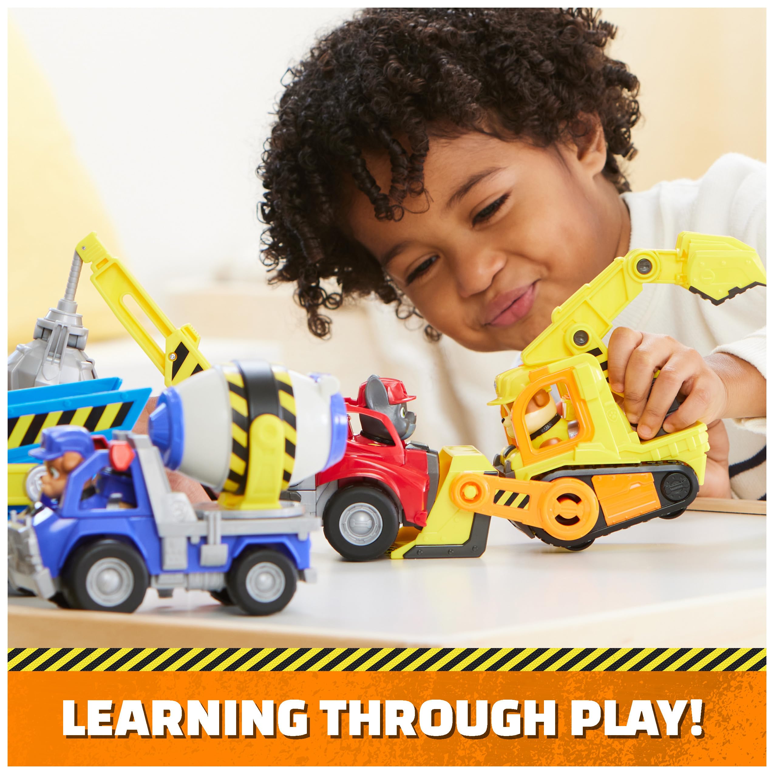Rubble & Crew learn-through-play toy set supports fine motor skills.