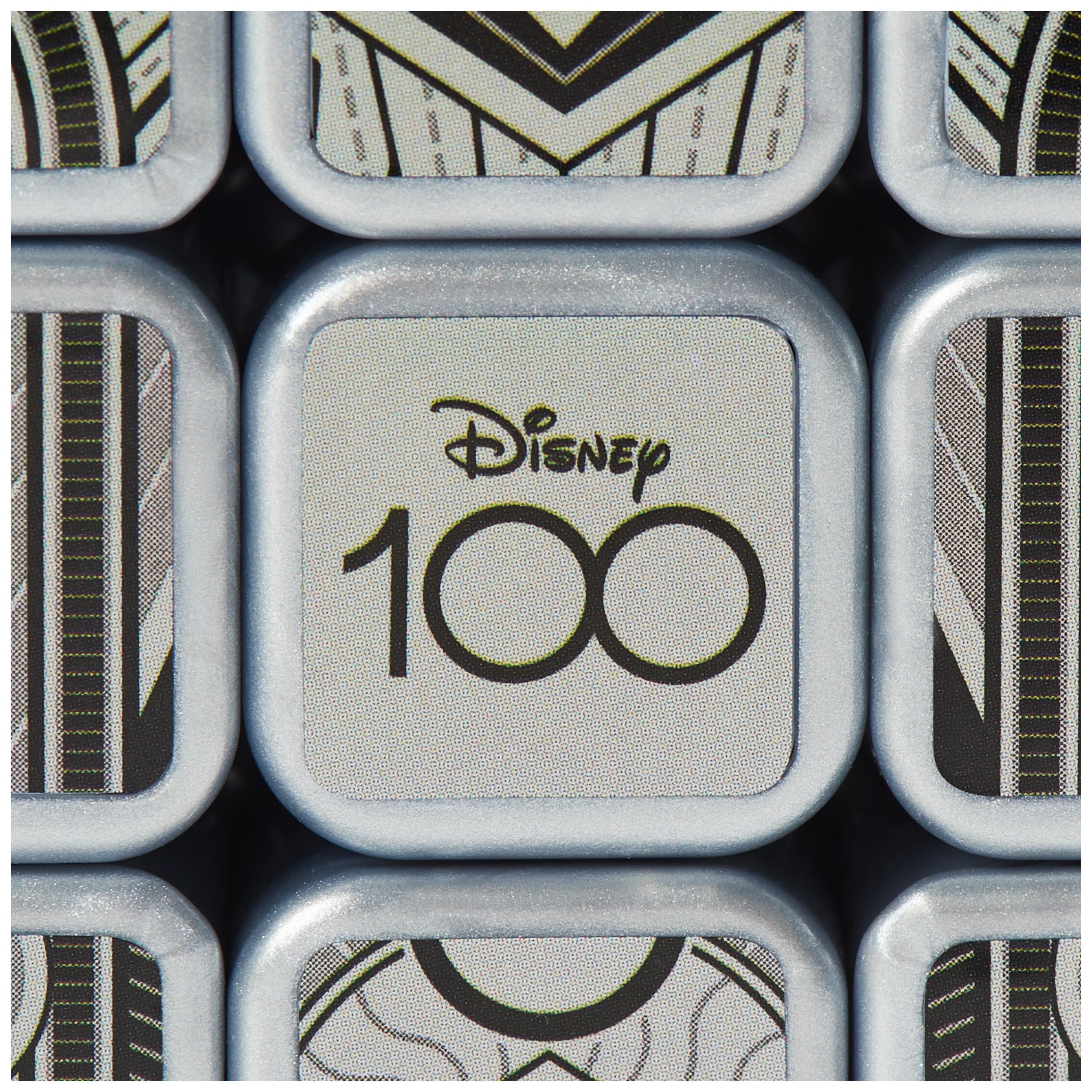 Rubik’s Disney100 Platinum Cube in hand, portable brain teaser for on-the-go play.