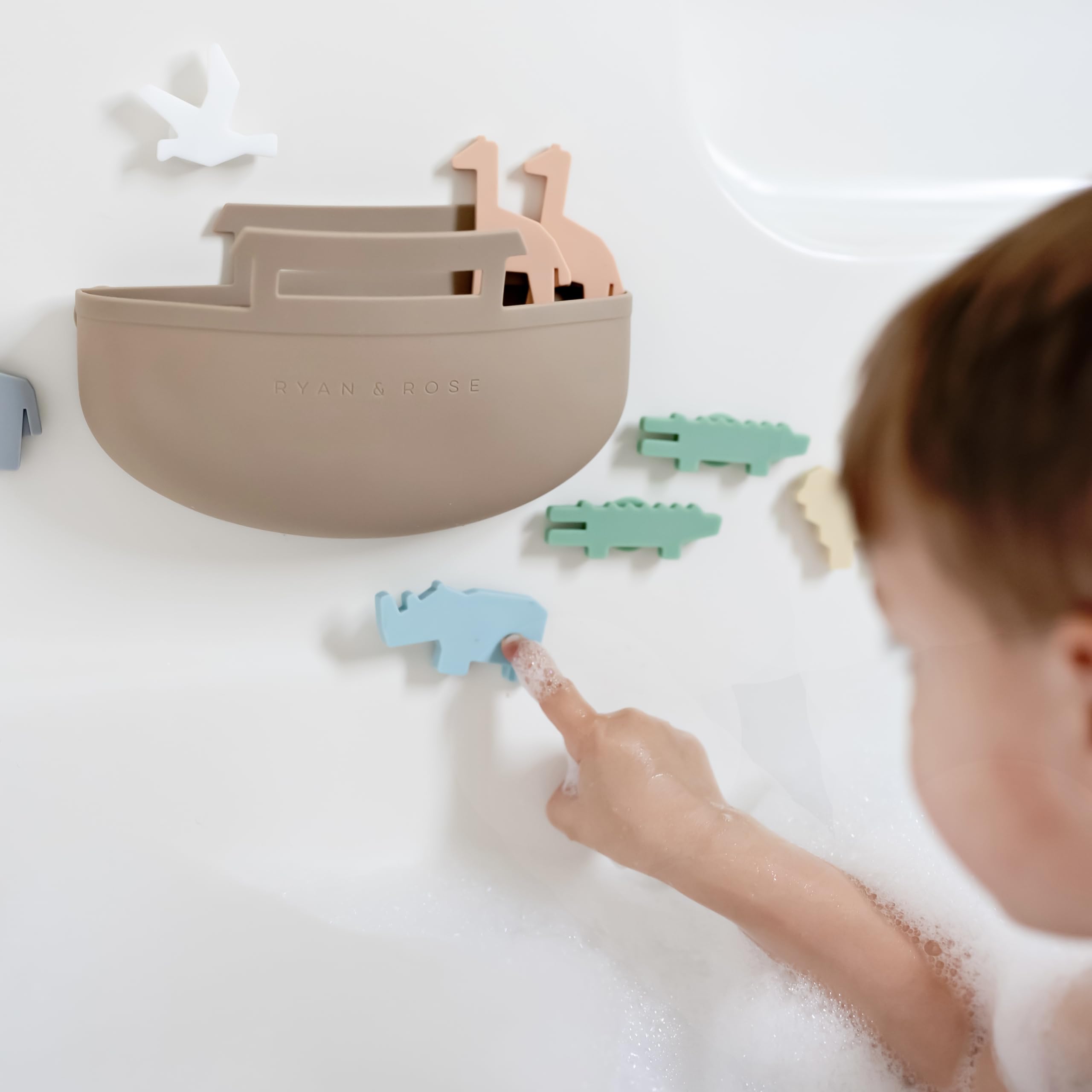 Ryan & Rose Noah's Ark storage design keeps toys organized after bath.