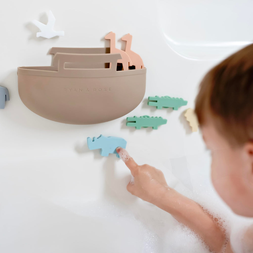 Ryan & Rose Noah's Ark storage design keeps toys organized after bath.