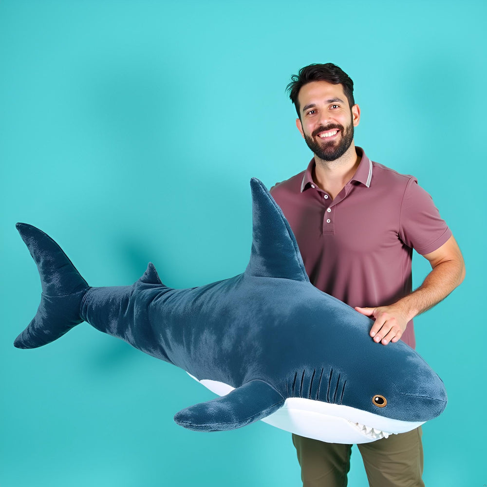 Ryttir giant shark plush serves as a lumbar pillow and decorative accent.