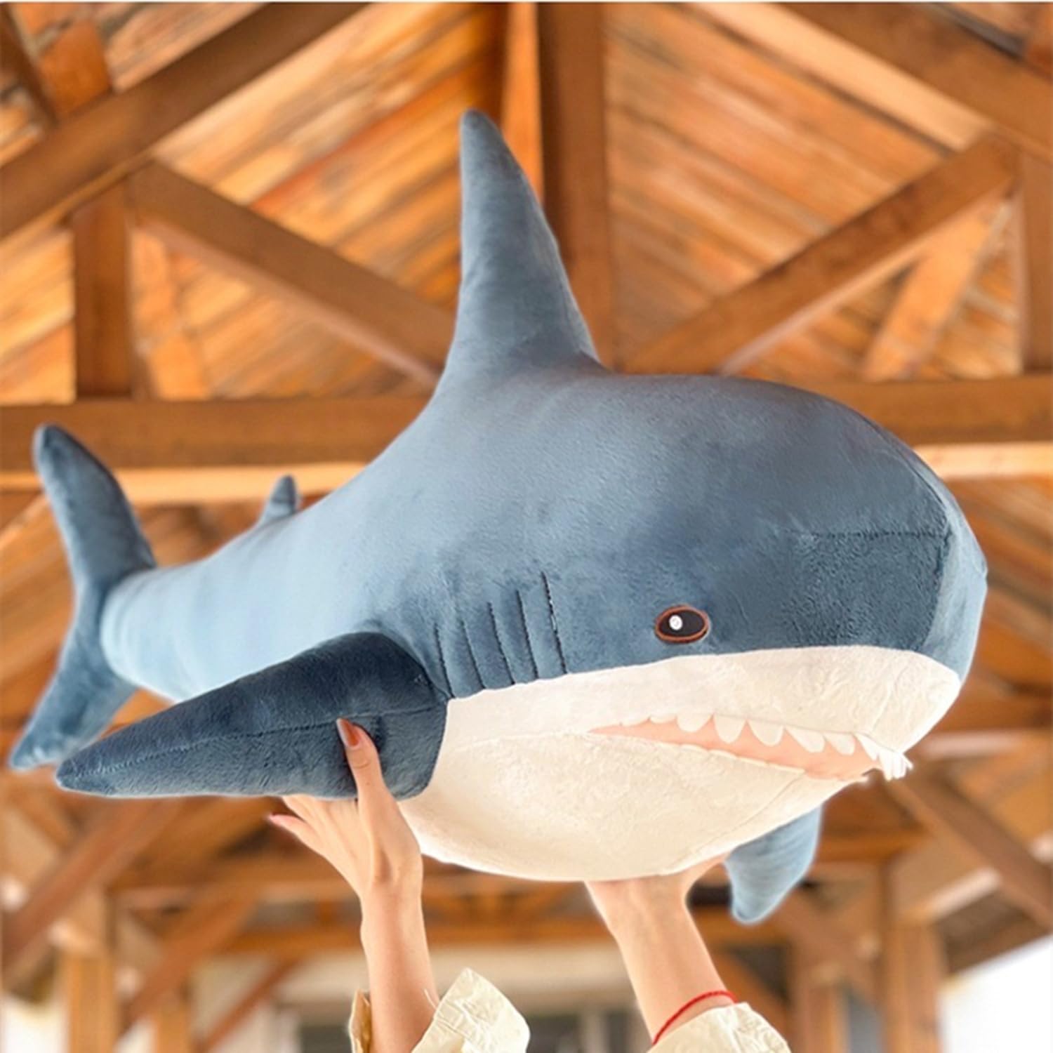 Ryttir shark plush lumbar pillow for desk or couch use.