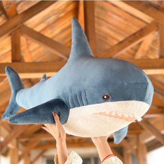Ryttir shark plush lumbar pillow for desk or couch use.