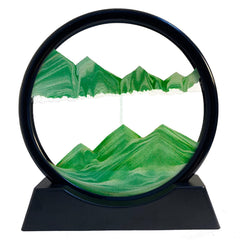 SANDCLE Moving Sand Art in a green 7-inch round glass frame for desk decor and relaxation.