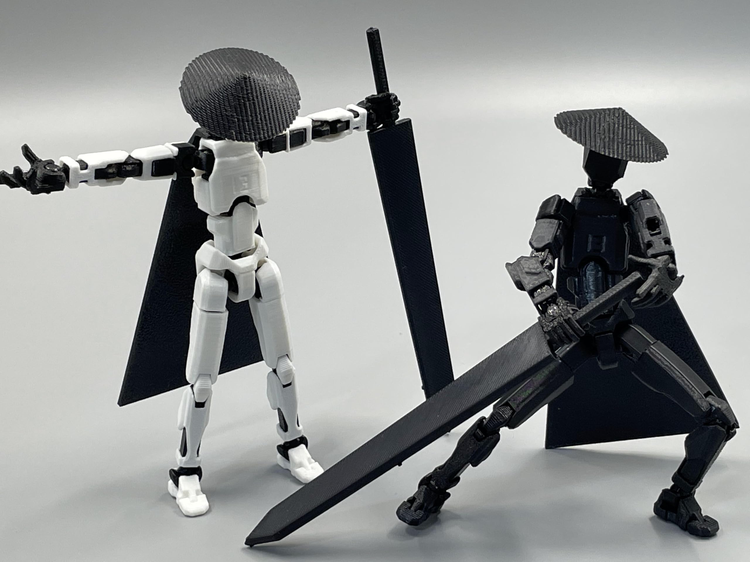 SANSGOUP Titan 13 black and white poseable figure for modern desks.