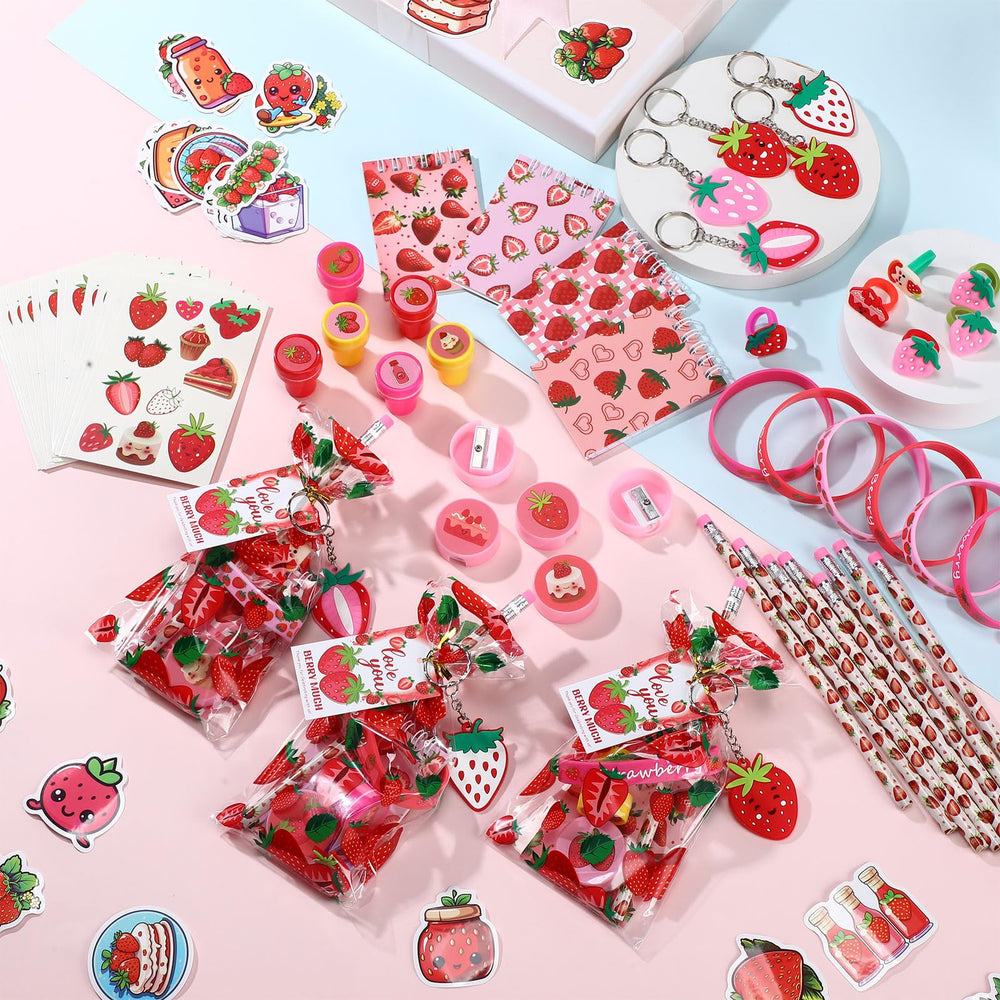 Sayglossy strawberry keychains add portable keepsakes for guests.