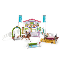 Schleich stable with horses and accessories for cozy stable scenes.