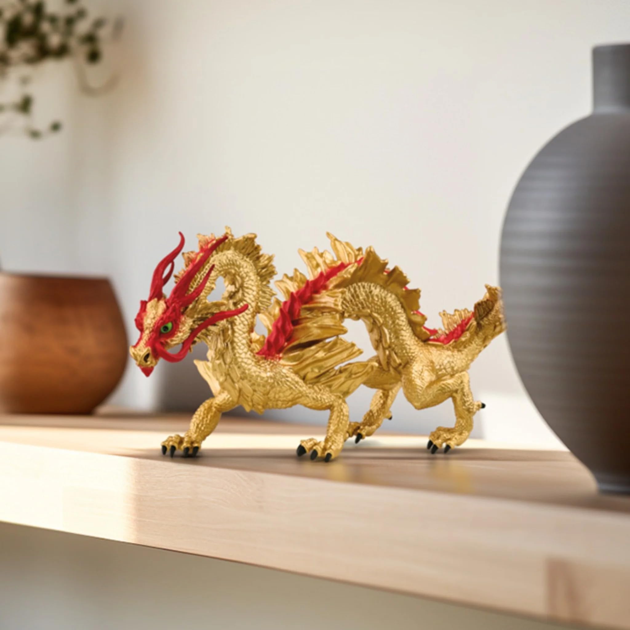 Schleich Lunar Dragon featuring fiery red spines for dramatic shelf presence.