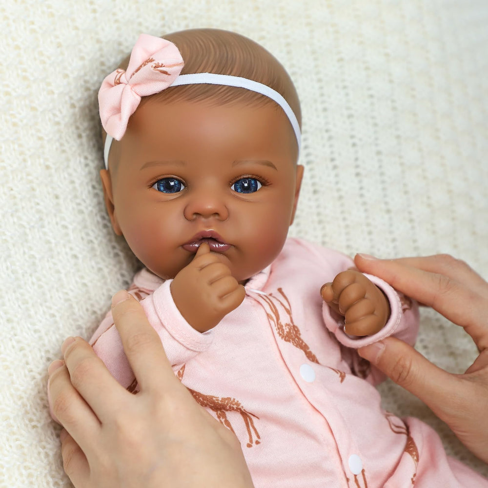 SCOM Black 18-inch bottle supports feeding-themed pretend play and nurturing moments.