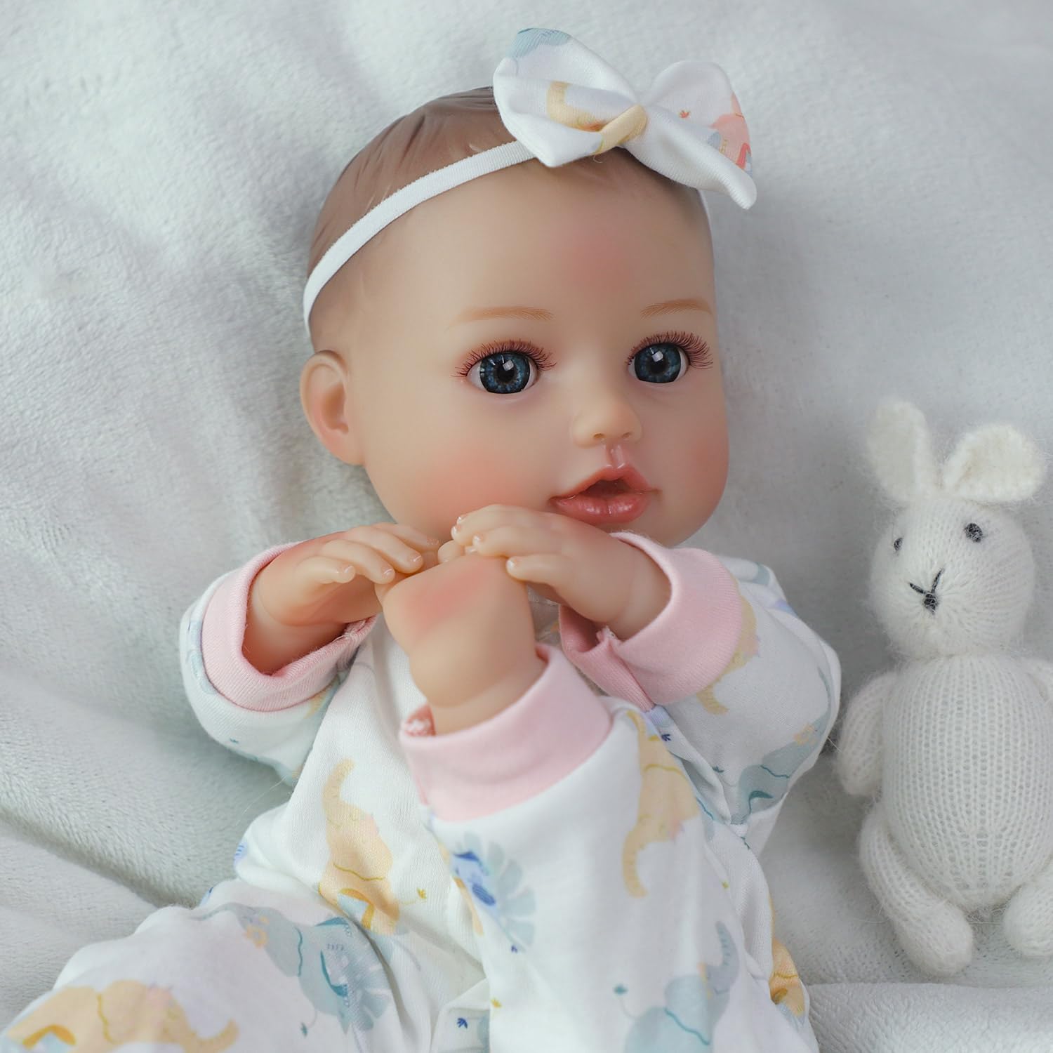 SCOM doll with textured scalp invites tactile discovery during pretend care.
