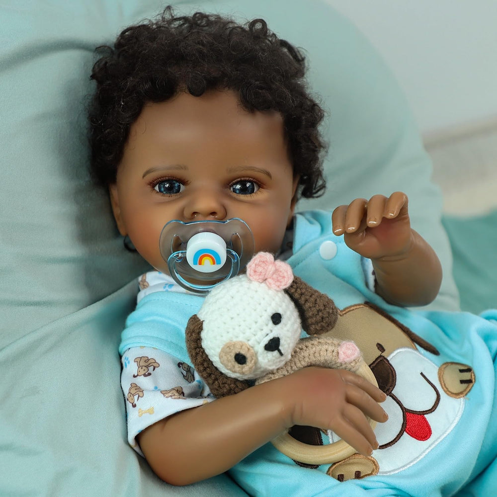 SCOM Quinbee highlights hand-drawn hair and eyelash detailing for authentic newborn look.