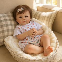SCOM Realistic Baby Doll gift box contents including clothing and box
