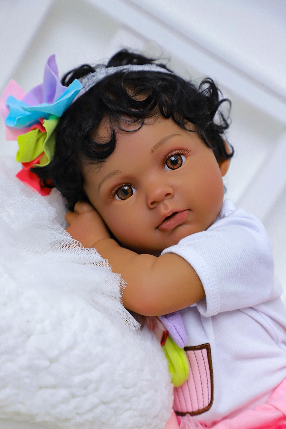 SCOM Anna on a pillow showing lifelike realism for imaginative play and companionship