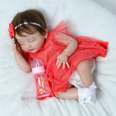 SCOM Reborn package includes clothing, bottle, diaper, birth certificate, and gift box
