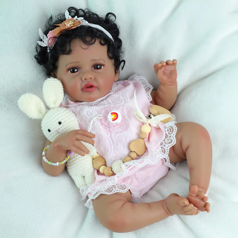SCOM Reborn Baby Doll arrives in gift-ready packaging with clothes for immediate unboxing.