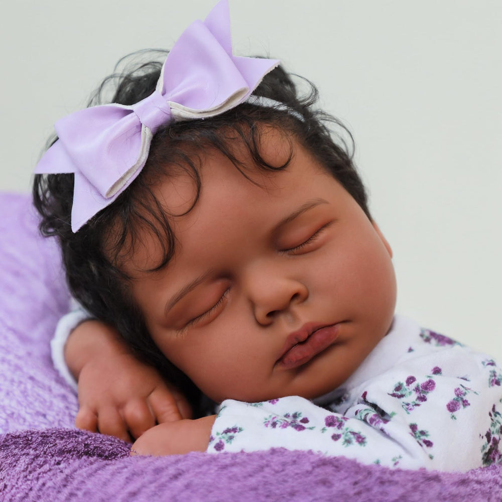 SCOM Reborn Baby Doll wearing purple lace-trimmed onesie for gentle, comforting play