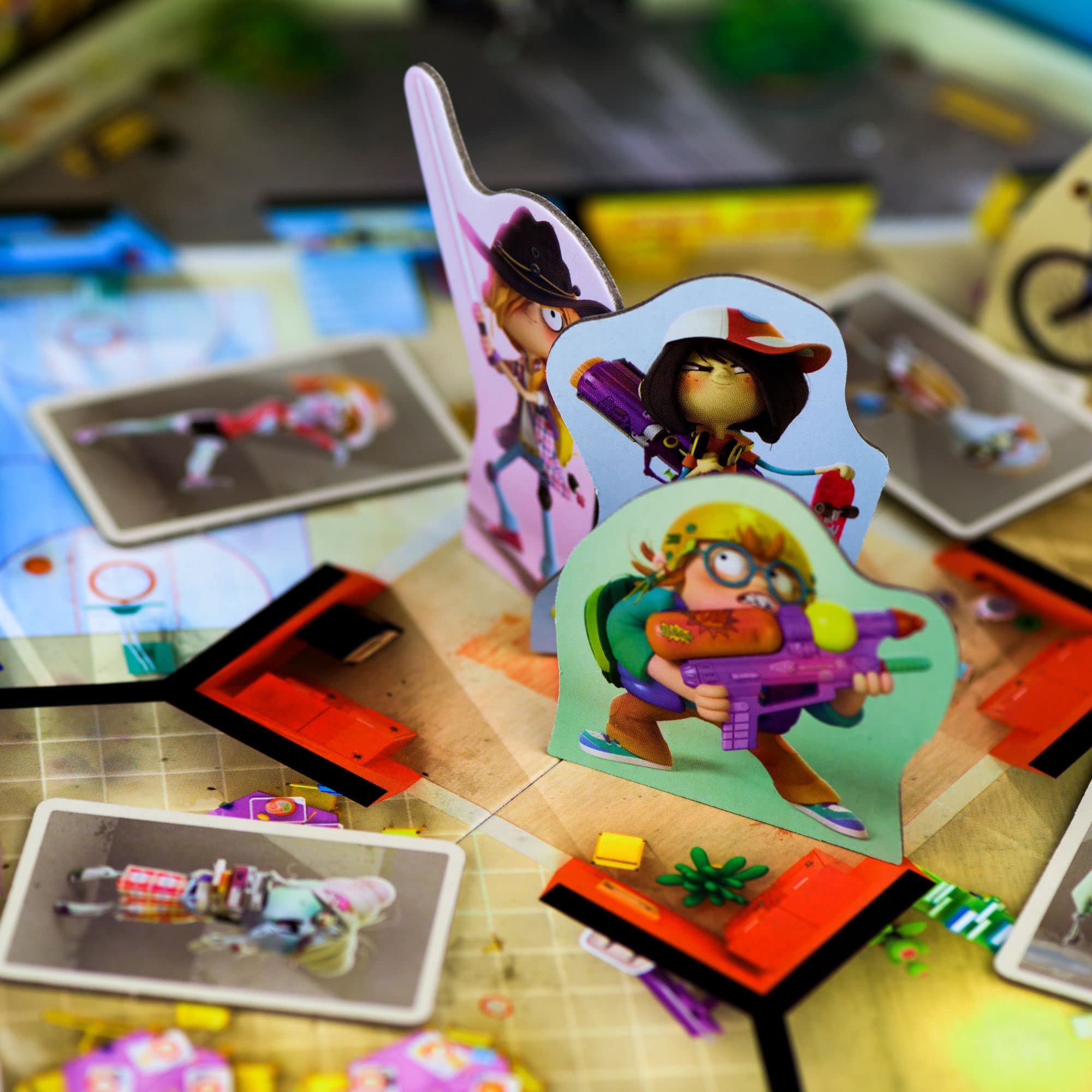 Zombie miniatures and colorful tiles evoke a friendly, adventurous vibe in Scorpion Masqué Zombie Kidz Evolution.