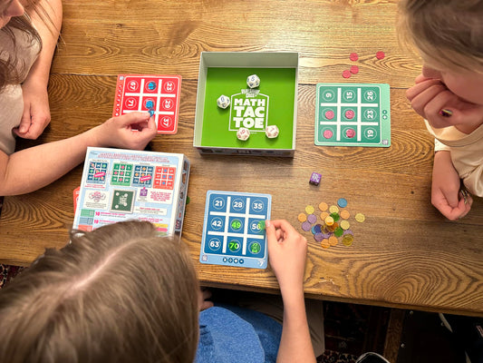 Semper Smart Games PlaySmart Dice Math-Tac-Toe dice close-up with color-coded faces