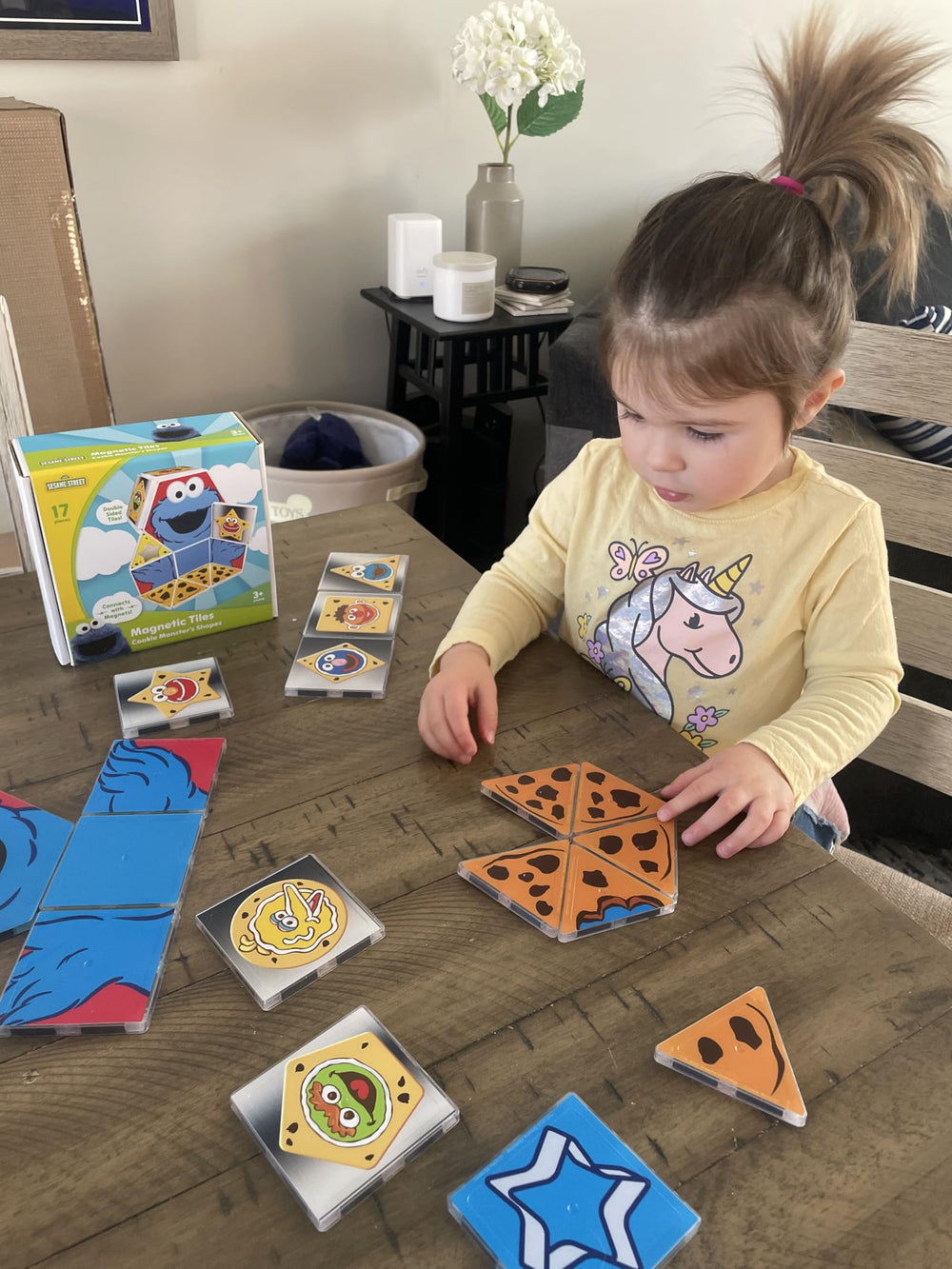 Sesame Street Cookie Monster in action with magnetic tiles for imaginative play.