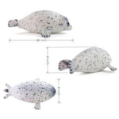Sew Butiful seal plush on a bed as decorative pillow for kids' rooms