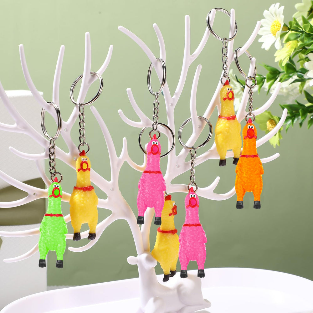 Shappy orange squeaky chicken keychain on keys, compact and easy to carry.